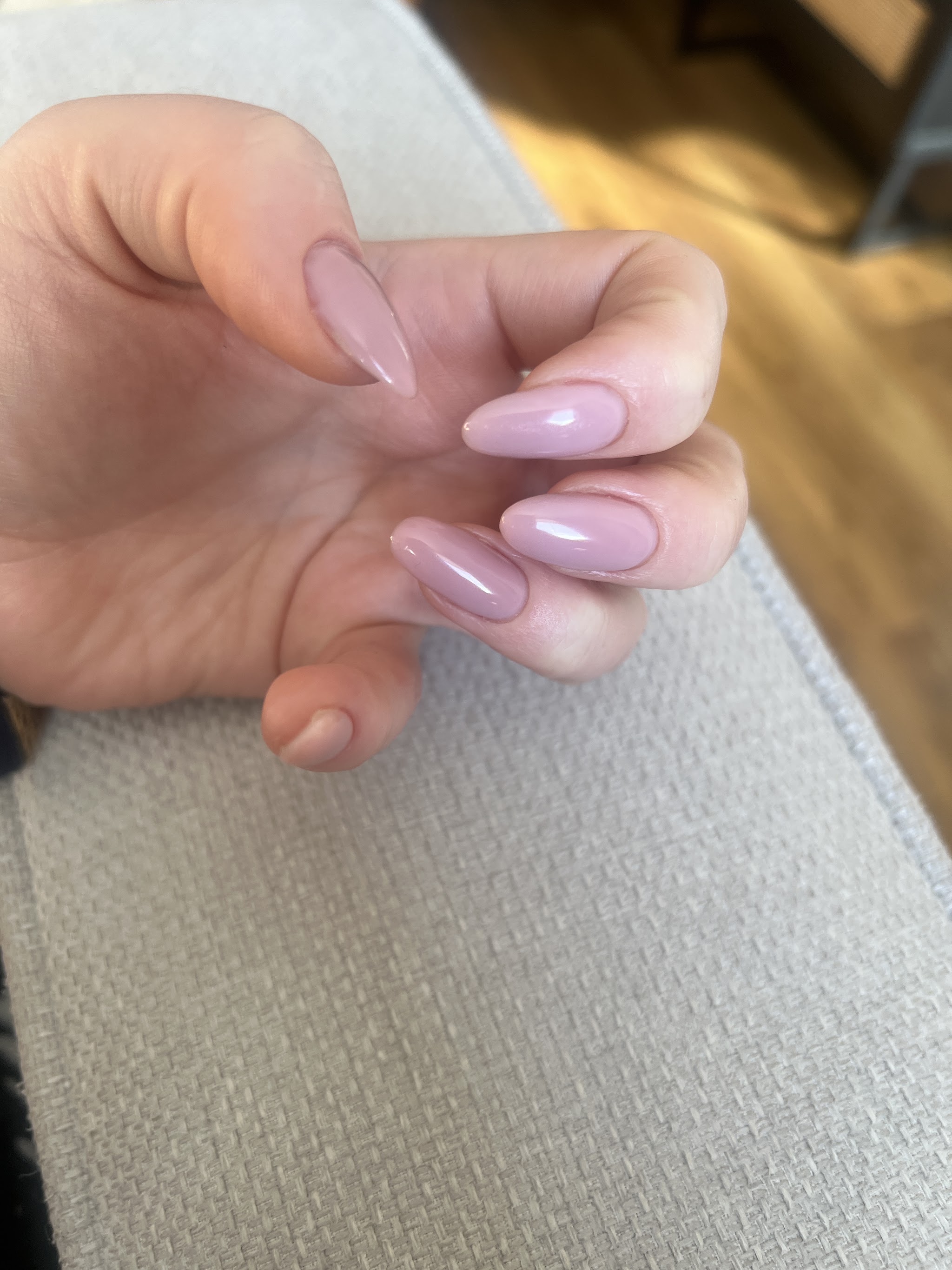 Long almond nails in a pale pink gel, a customer's photo